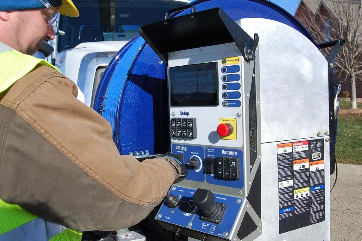Operator using IntuiTouch controls on Vactor 2100i